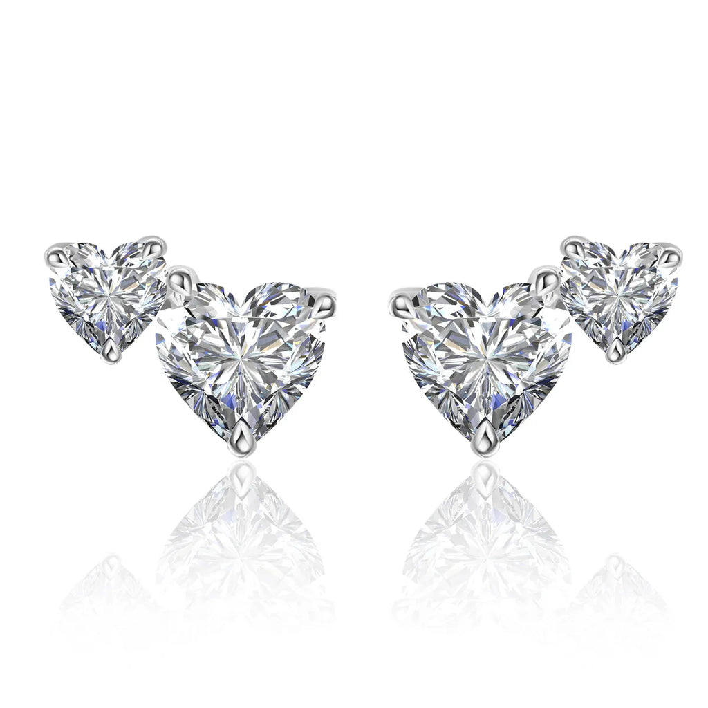 Heart-shaped moissanite diamond earrings on a white background