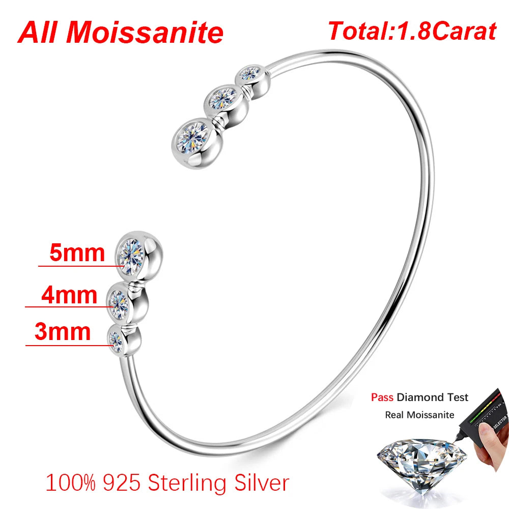 Silver bracelet with embedded moissanite stones on a white background