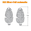 Silver leaf-shaped earrings with clear stones on a white background, labeled '925 Silver + Full moissanite'.