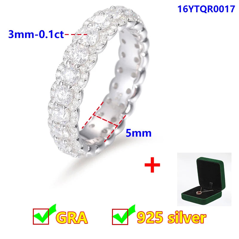 Silver ring with moissanite stones, measurements, and a green jewelry box on a white background.