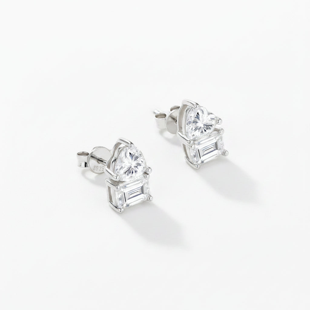 Pair of silver stud earrings with moissanite gemstones on a white background