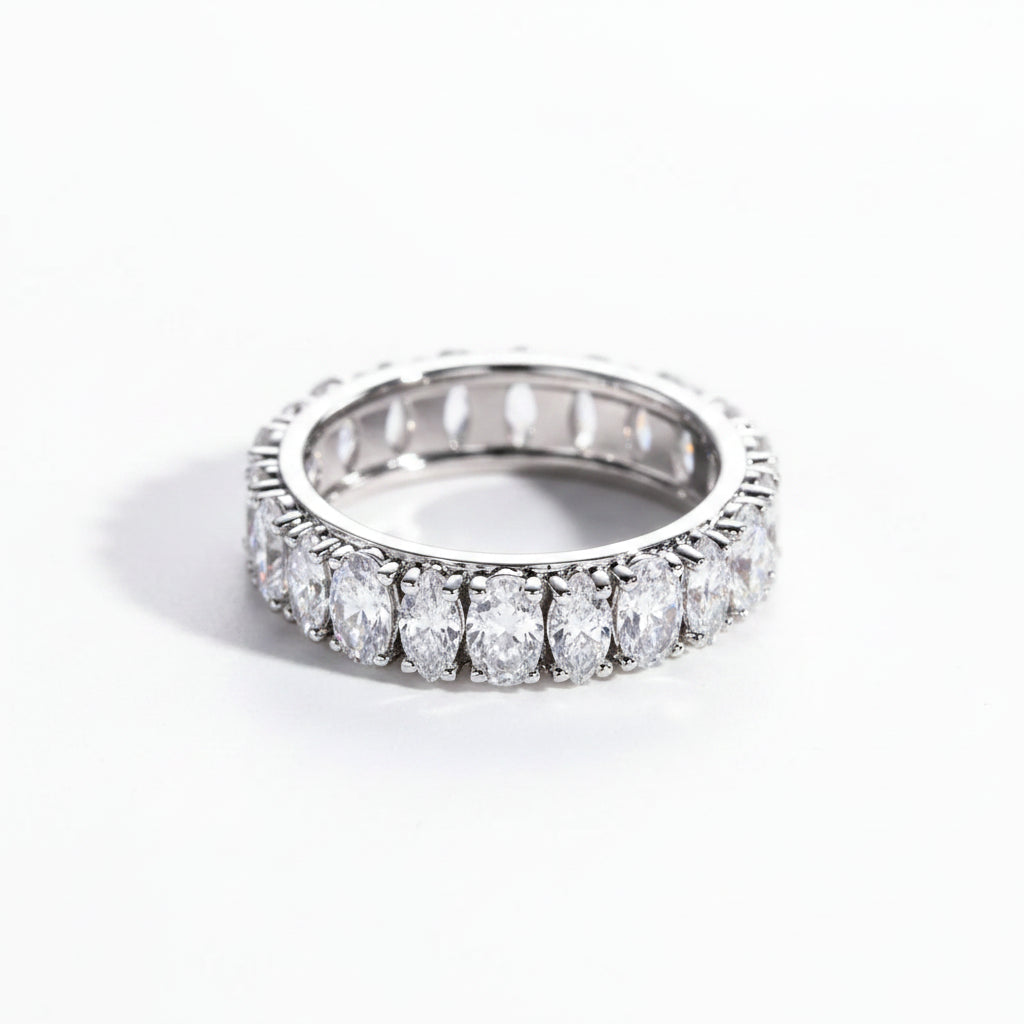 Silver ring with multiple rows of moissanite on a white background