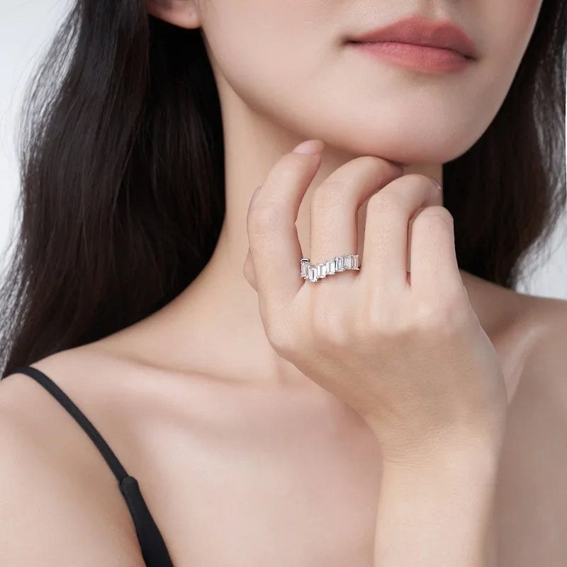 Close-up of a woman wearing a moissanite ring on her hand