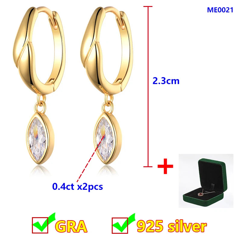 Gold hoop earrings with moissanite stones, measurement details, and a green jewelry box on a white background.
