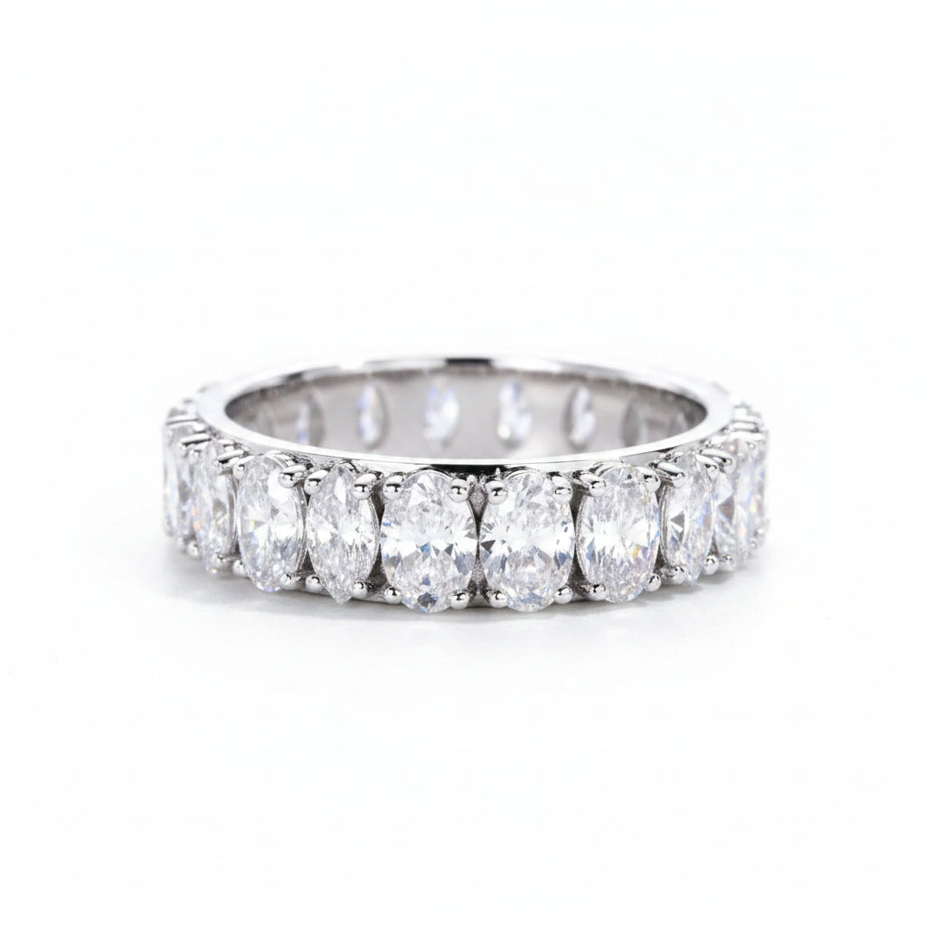 Diamond ring with pear-shaped stones on a white background