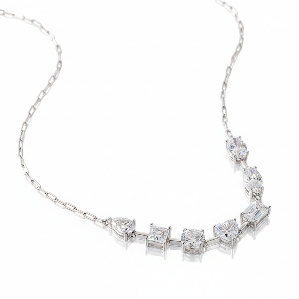 Silver necklace with moissanite stones on a white background