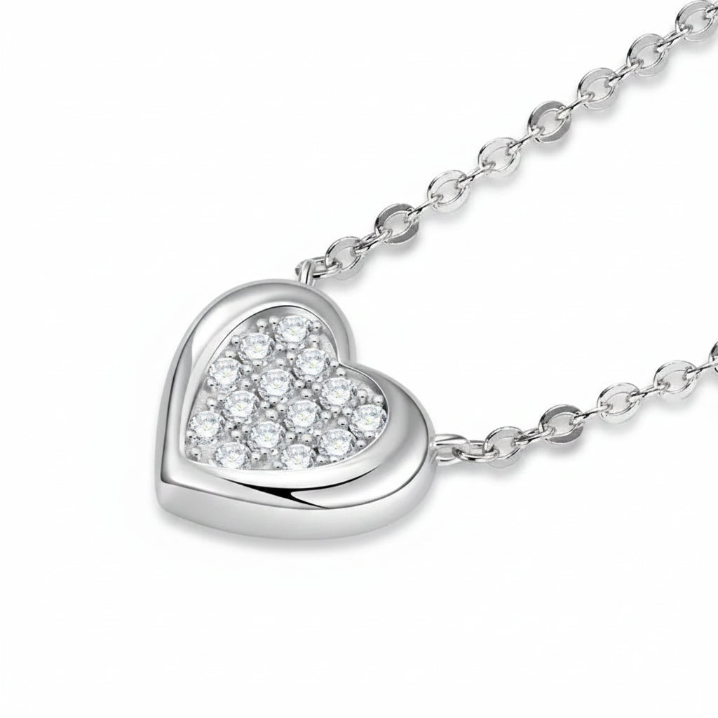 Silver heart-shaped pendant necklace on a white background