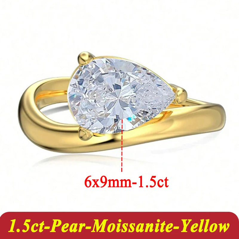 Gold ring with pear-shaped moissanite on a white background