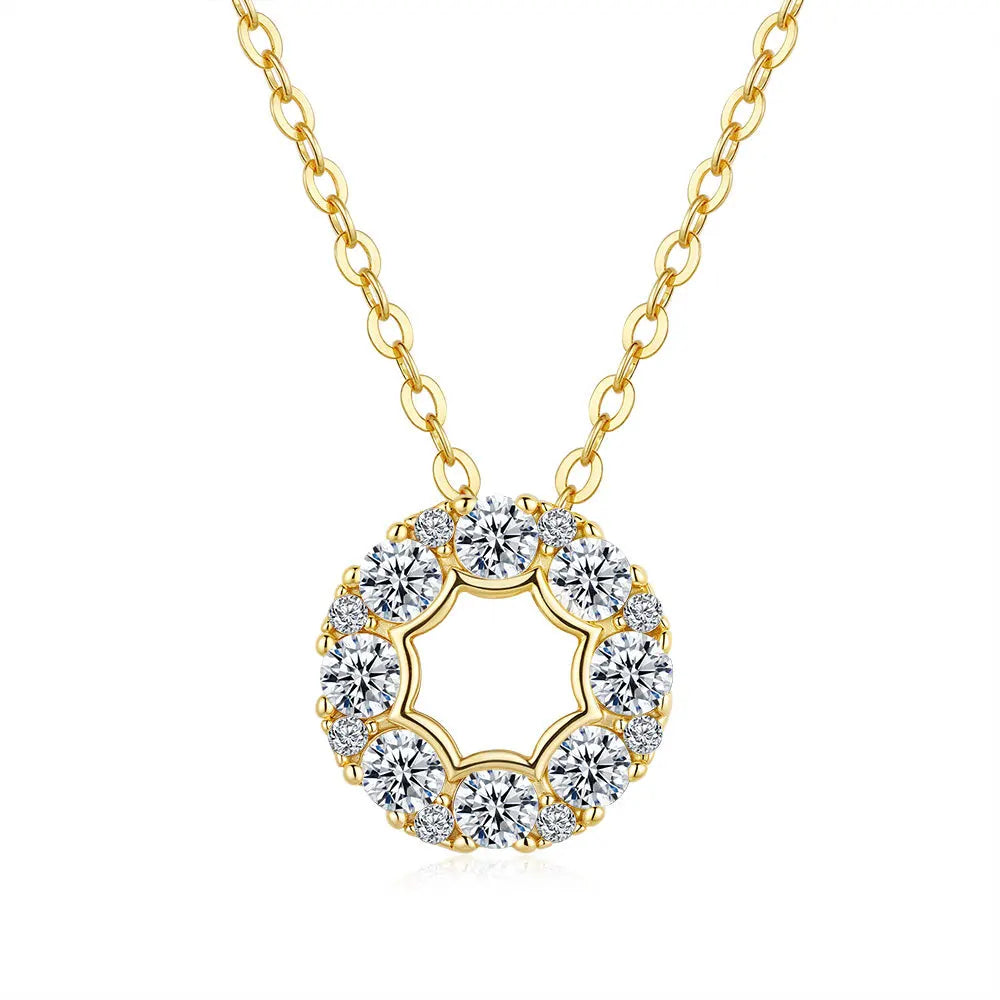 Gold necklace with a circular moissanite diamond pendant on a white background