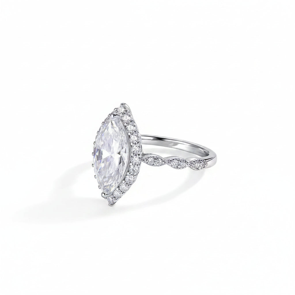 Silver ring with a large marquise-shaped diamond on a white background