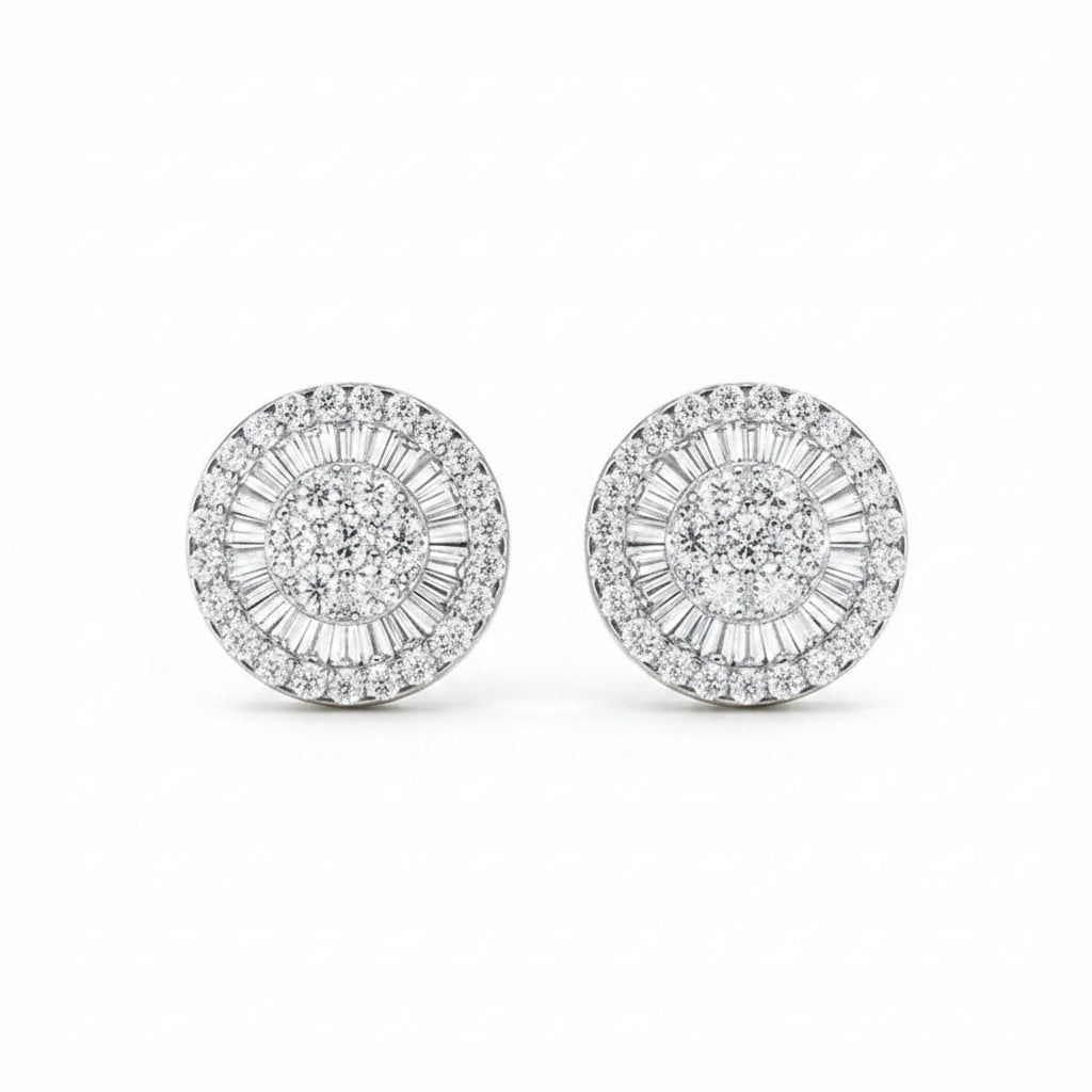 Pair of silver earrings with diamond accents on a white background