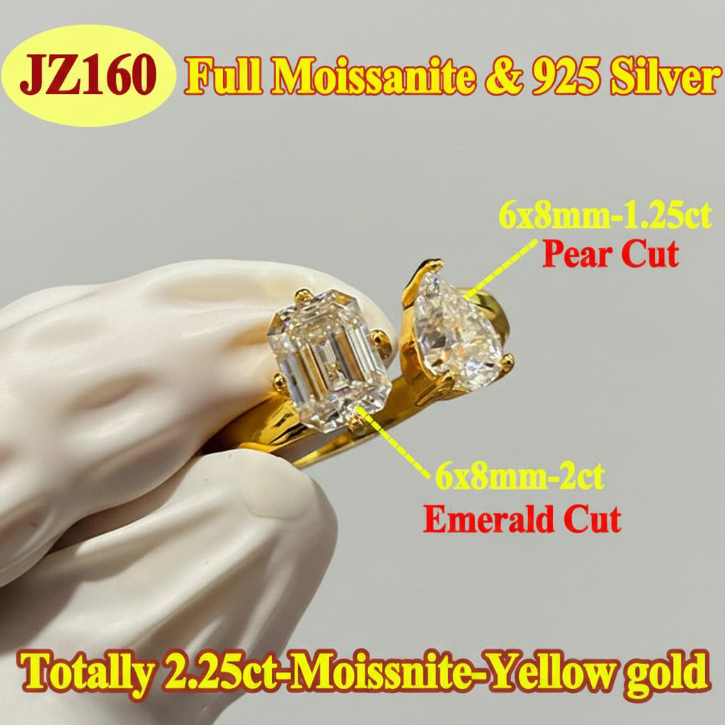 Gold ring with emerald and pear cut moissanites held by a white hand, with text detailing stone sizes and types.