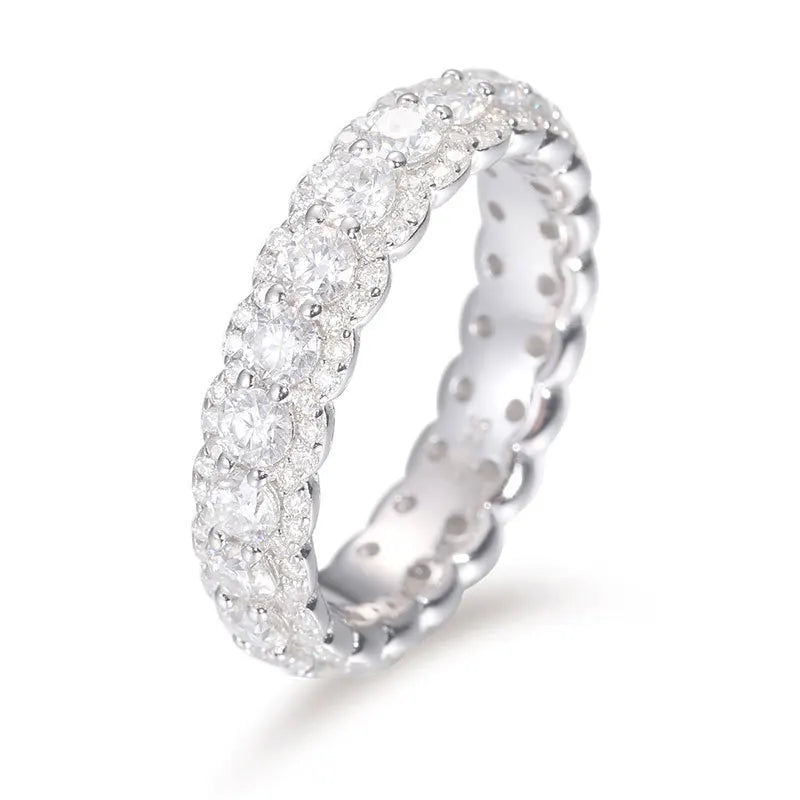 Silver ring with diamond accents on a white background