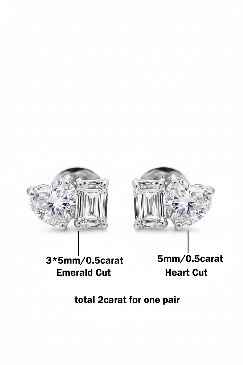 Pair of moissanite diamond earrings with heart and emerald cut stones on a white background
