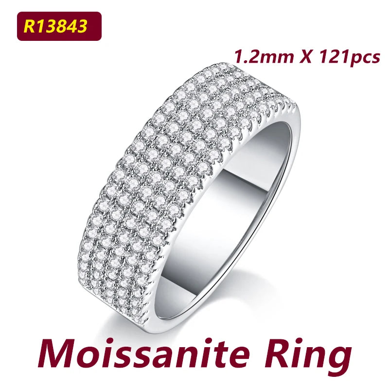 Moissanite ring with detailed design on a white background