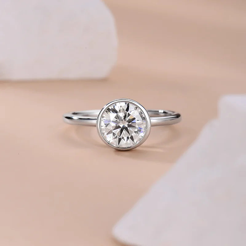 Silver ring with a large diamond on a neutral background