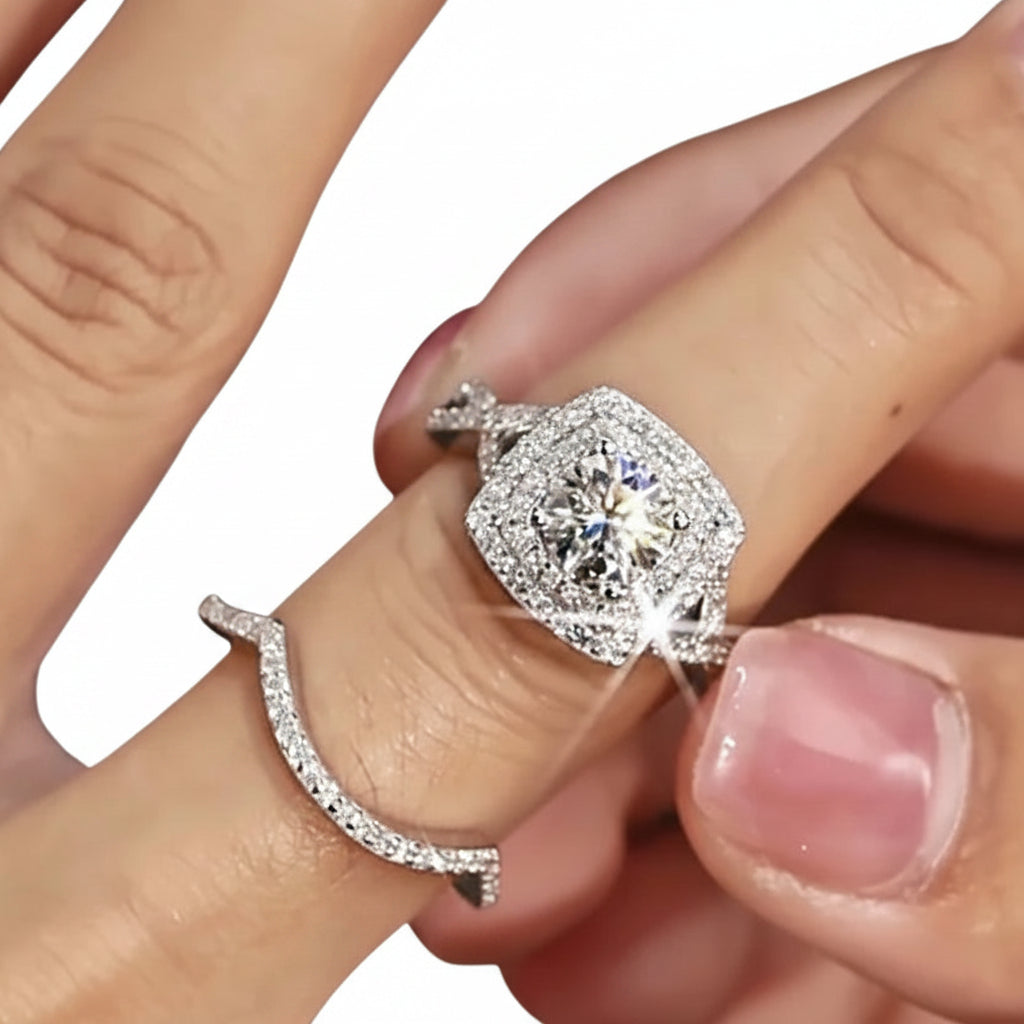 Close-up of a hand wearing a moissanite diamond ring. 
