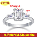 Silver ring with emerald-cut moissanite and zircon stones on a white background