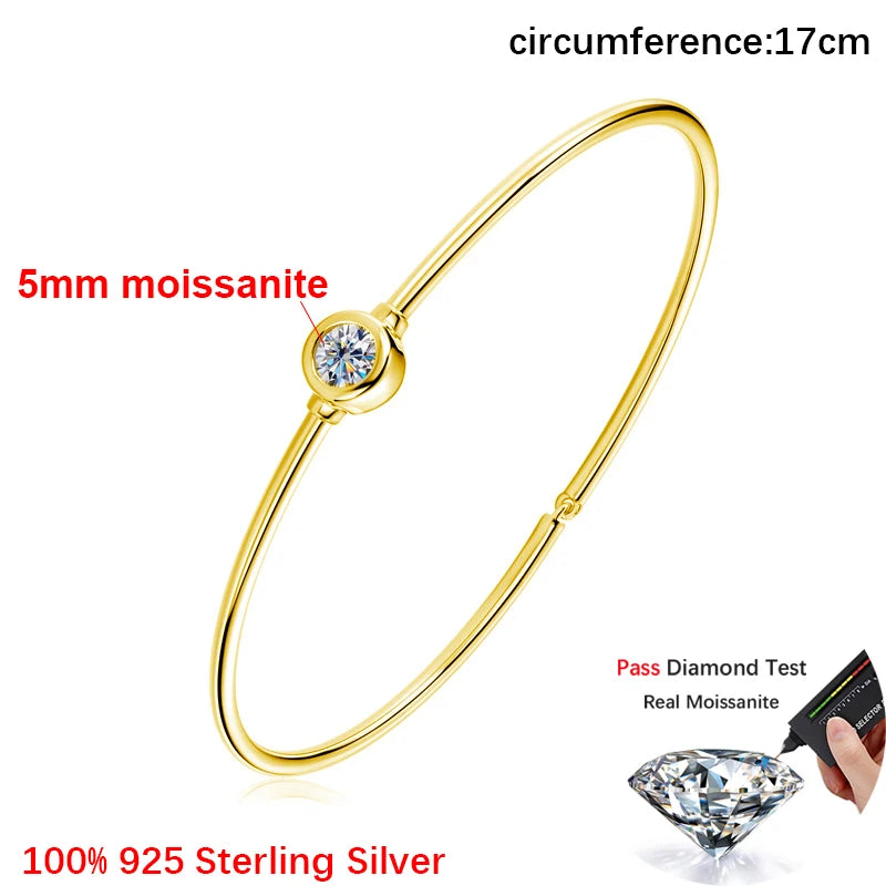 Gold bracelet with moissanite gemstone on a white background