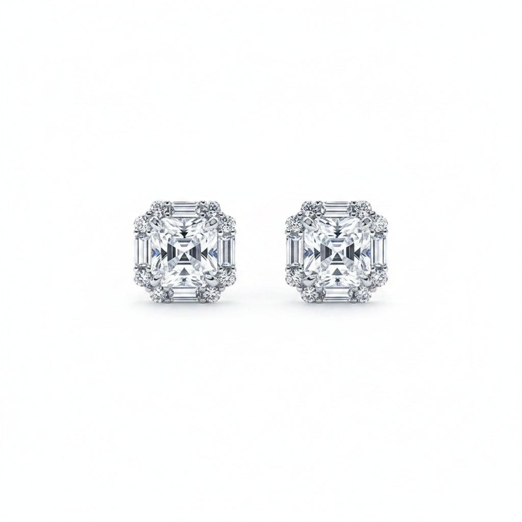 Pair of moissanite diamond earrings on a white background.