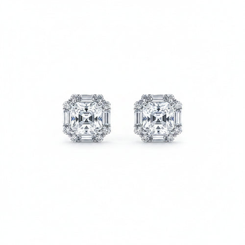 Pair of moissanite diamond earrings on a white background.