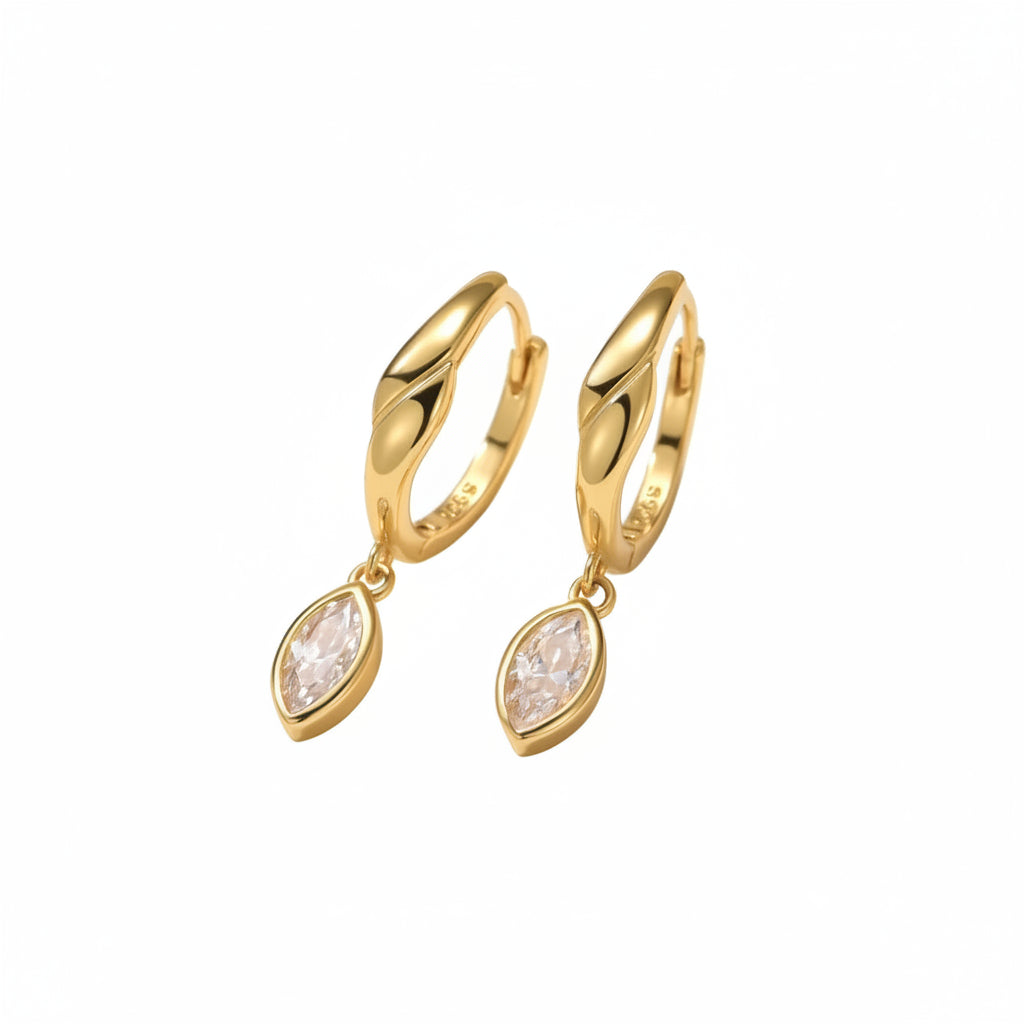 Gold hoop earrings with teardrop-shaped gemstones on a white background