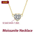 Heart-shaped moissanite necklace with gold chain on a white background