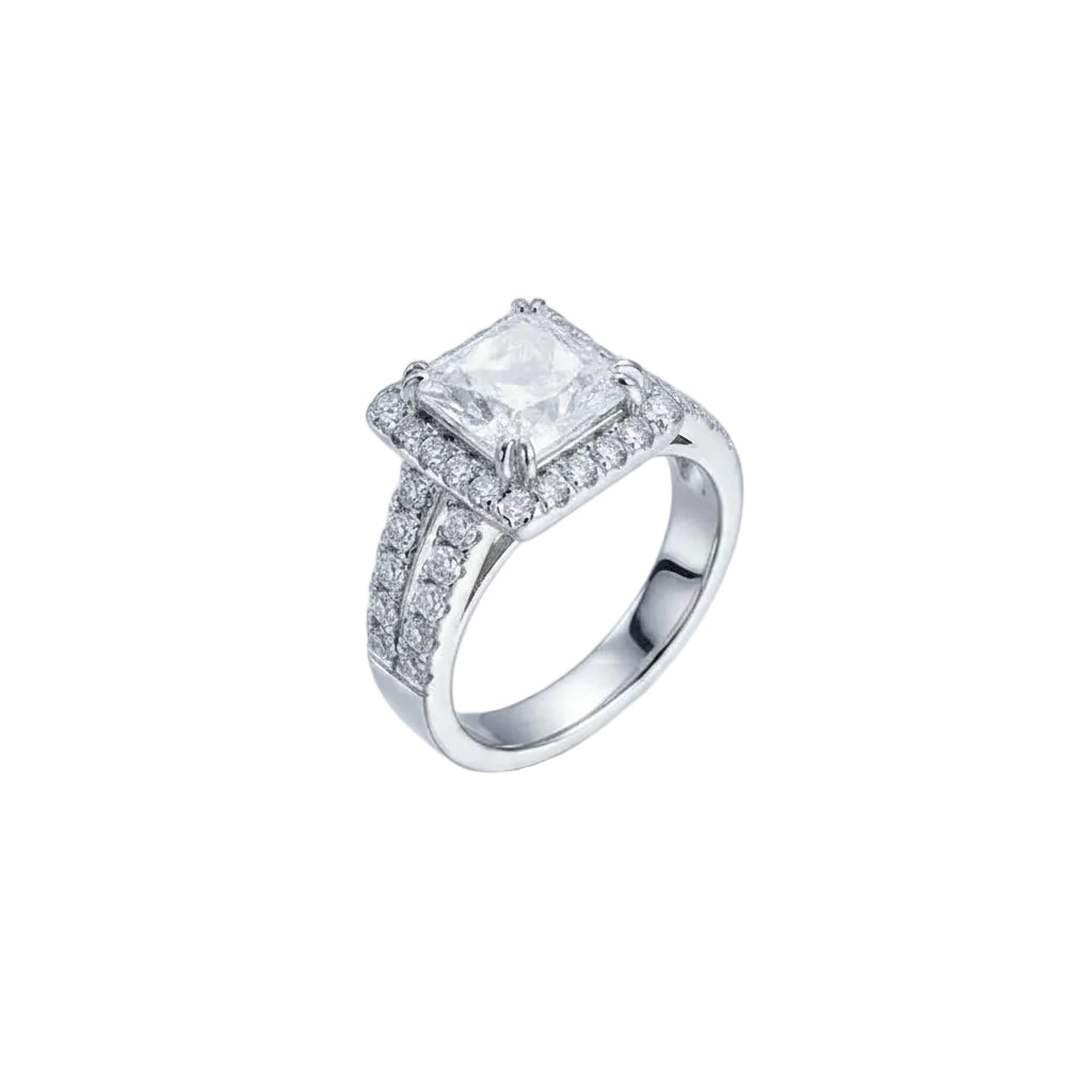 Silver ring with a large diamond and smaller diamonds on a white background