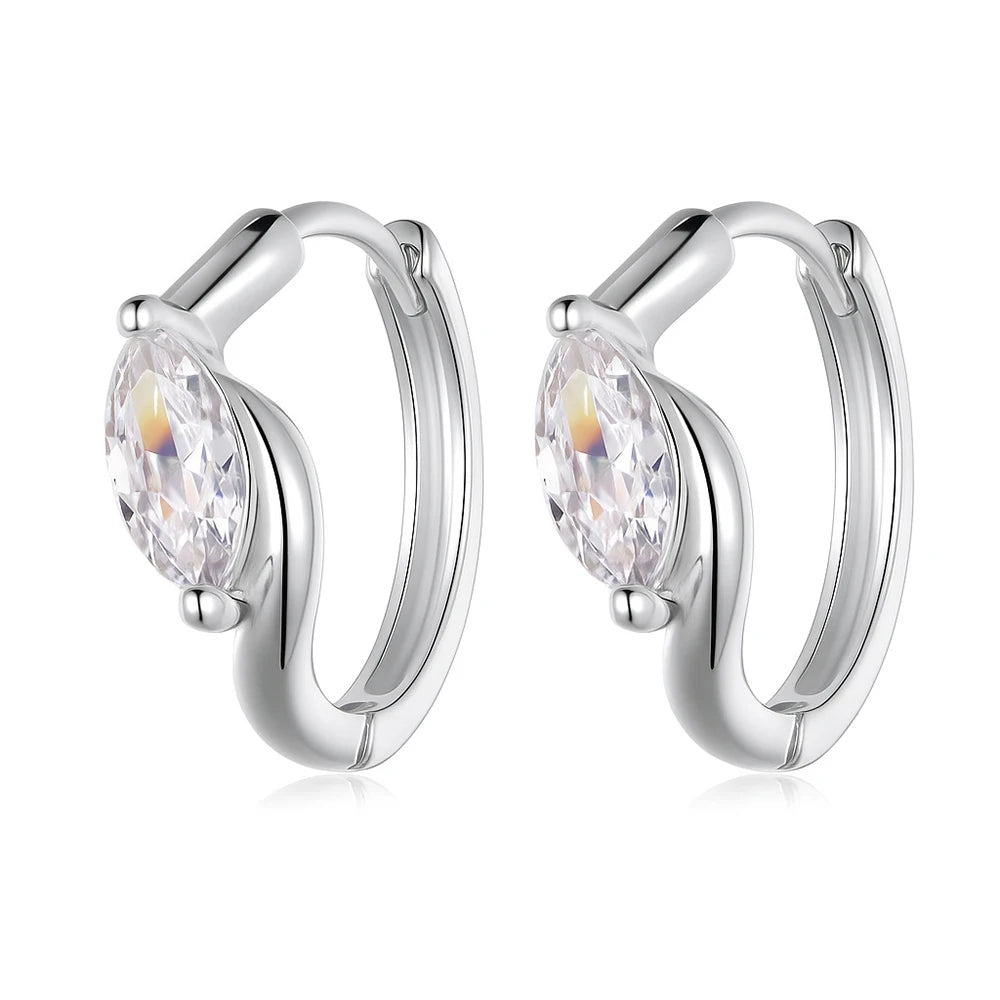 Silver hoop earrings with moissanite gemstones on a white background