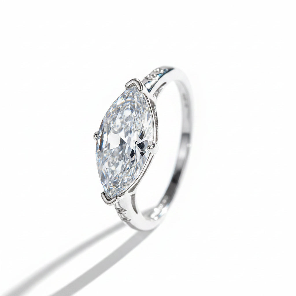 Silver ring with a large moissanite on a white background