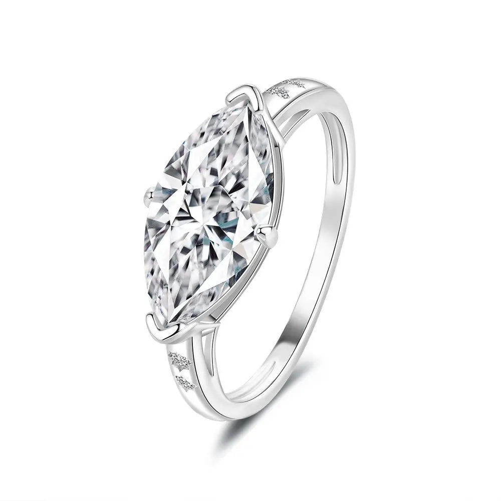 Silver ring with a large clear gemstone on a white background