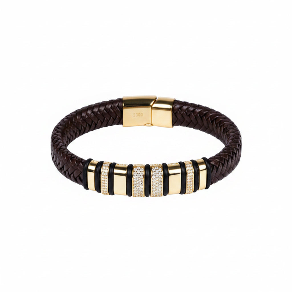 Gold and black braided bracelet on a white background