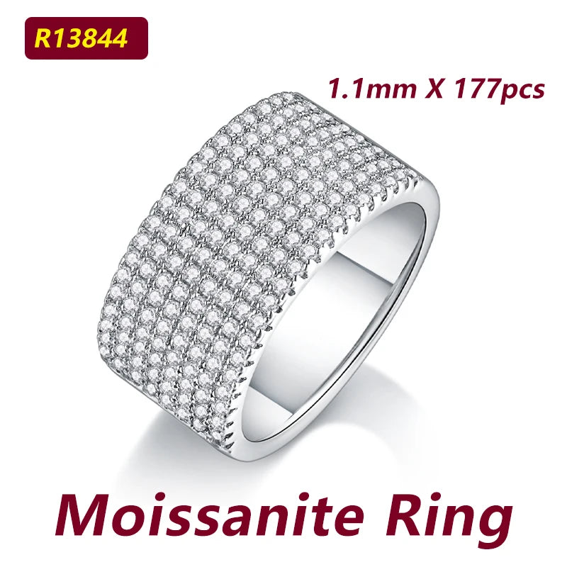 Moissanite ring with detailed design on a white background