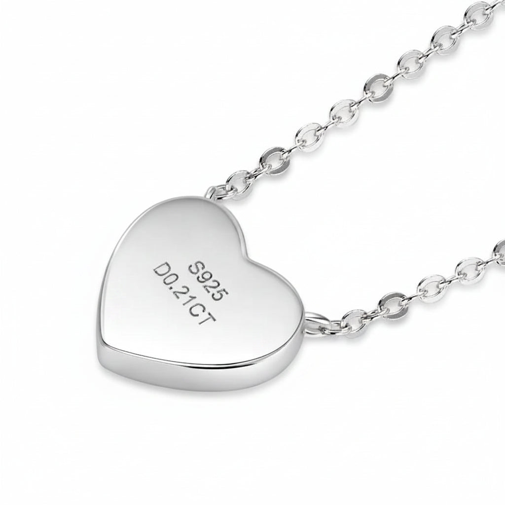 Silver heart-shaped pendant with chain on a white background