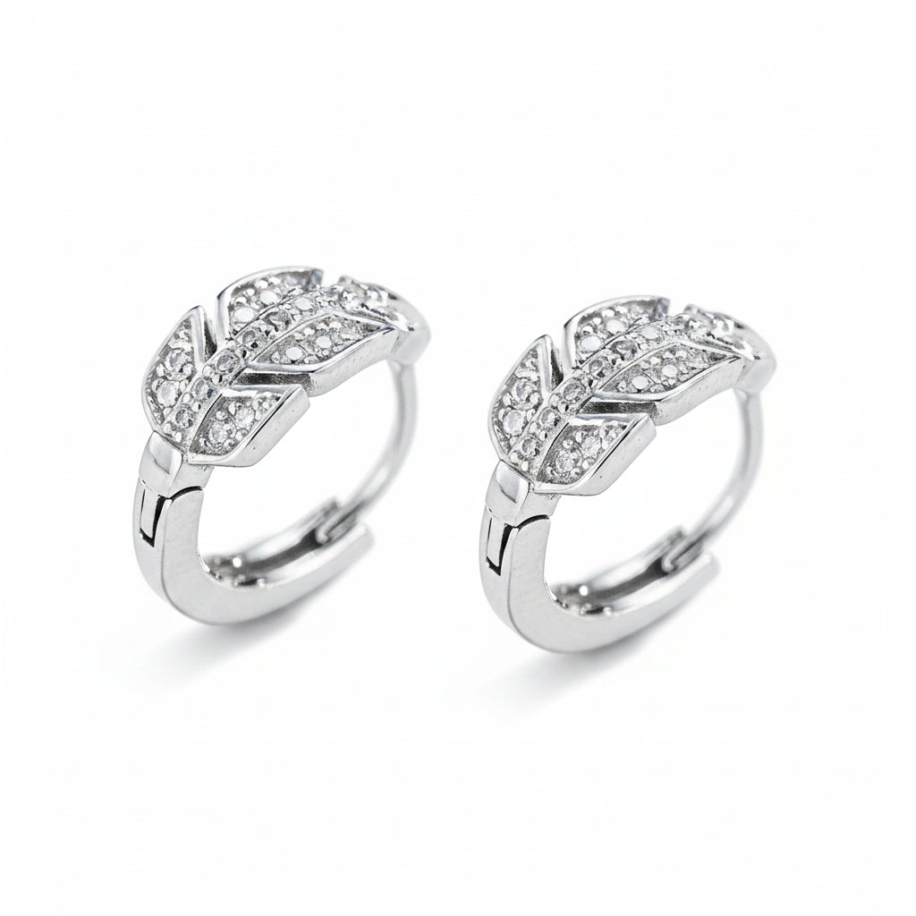 Pair of silver rings with moissanite diamond accents on a white background