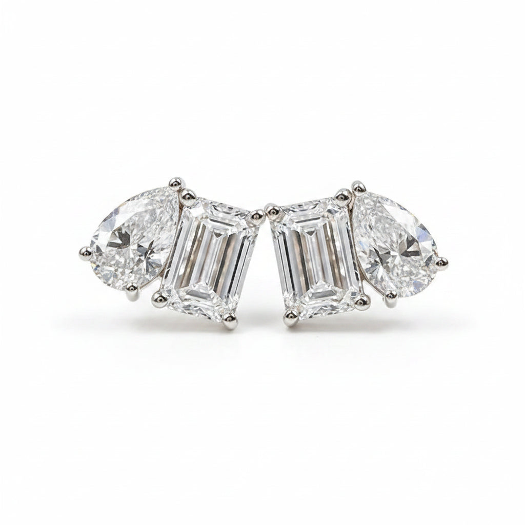 Moissanite diamond earrings on a white background